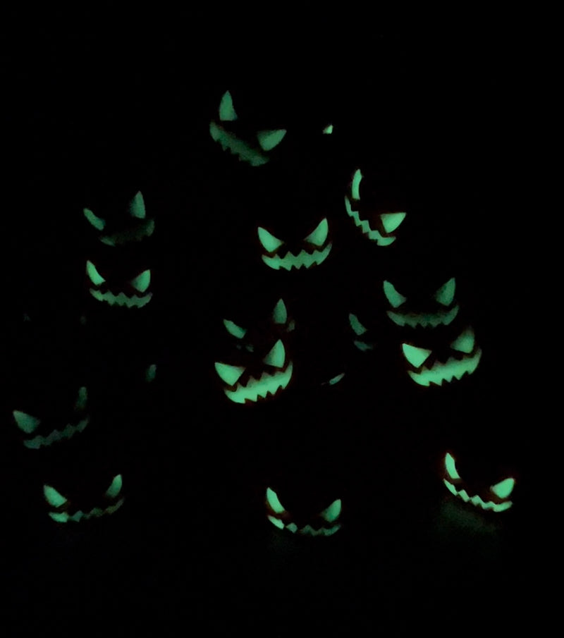pumpkin faces glowing in the dark